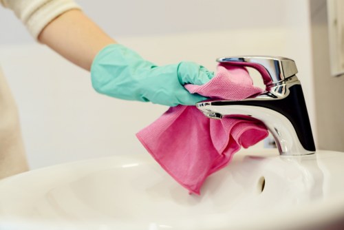 Local upholstery cleaner treating stains on a family sofa in Earlscourt