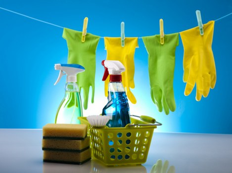 Cleaner washing storefront windows in Earlscourt